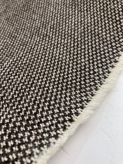 Unrecognized Woll contract fabrics.